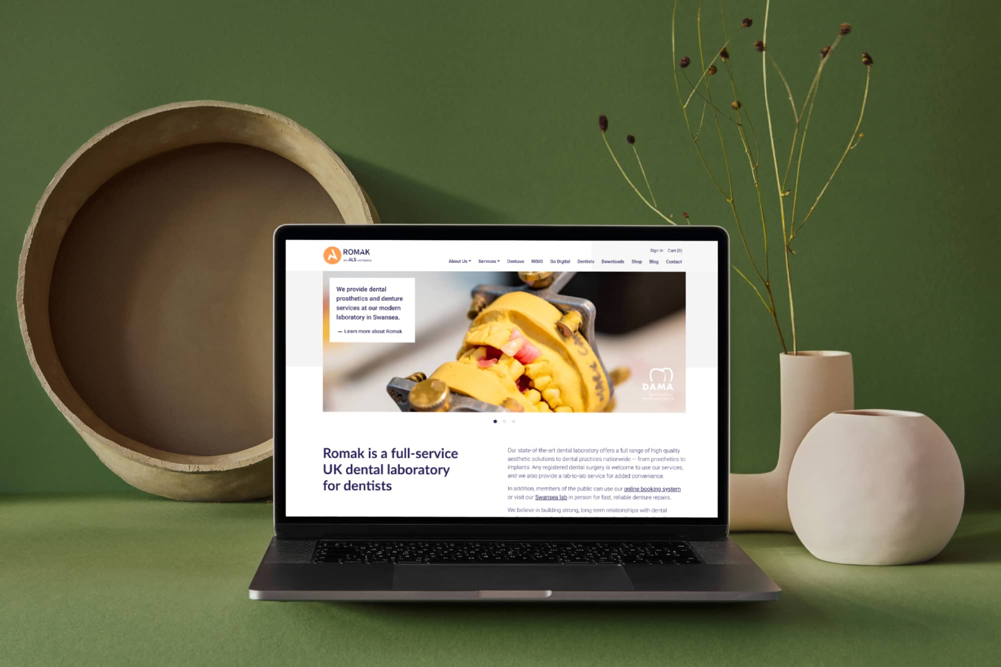 Romak Dental Laboratory WordPress website, showcasing dental solutions and eCommerce capabilities.